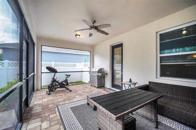 view of patio / terrace with fence, a ceiling fan, and area for grilling