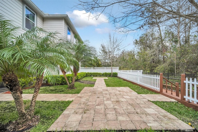 exterior space with a patio and a fenced backyard