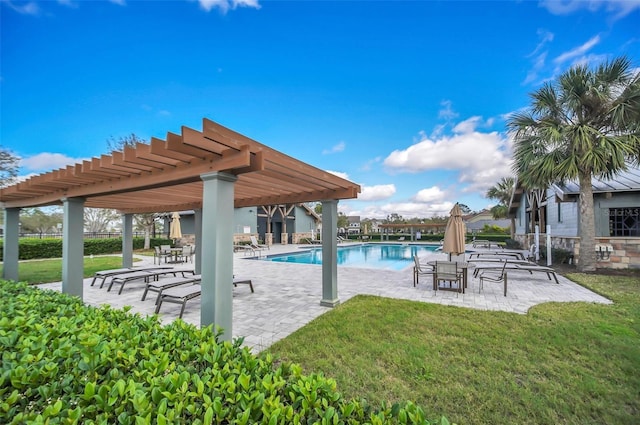 community pool with a patio area, a yard, and a pergola