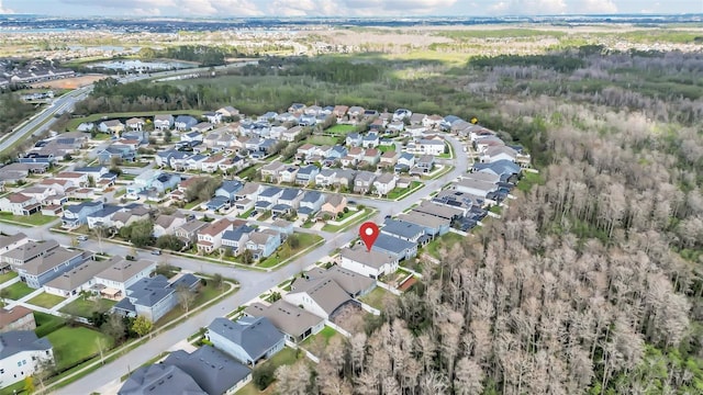 birds eye view of property with a residential view