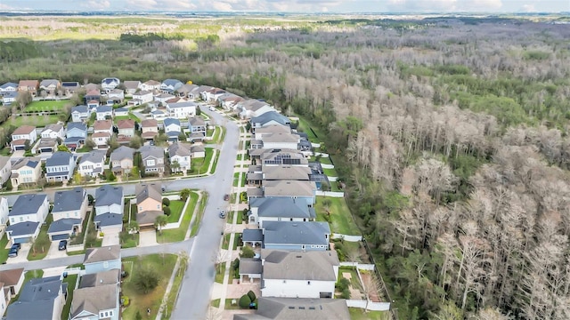 aerial view featuring a residential view and a view of trees