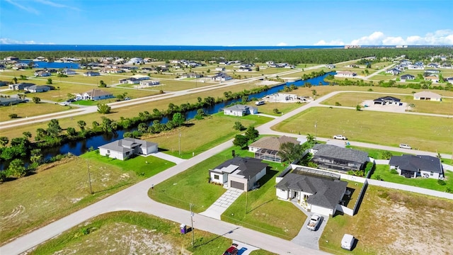 bird's eye view with a water view and a residential view