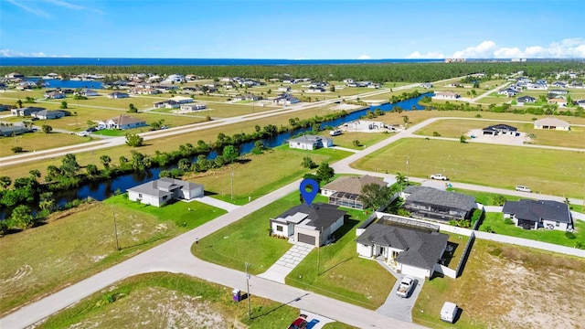 aerial view with a water view and a residential view