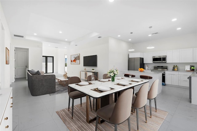 dining space with marble finish floor, visible vents, and recessed lighting