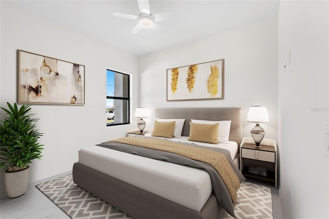 bedroom featuring marble finish floor and a ceiling fan