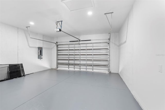 garage with electric panel and a garage door opener