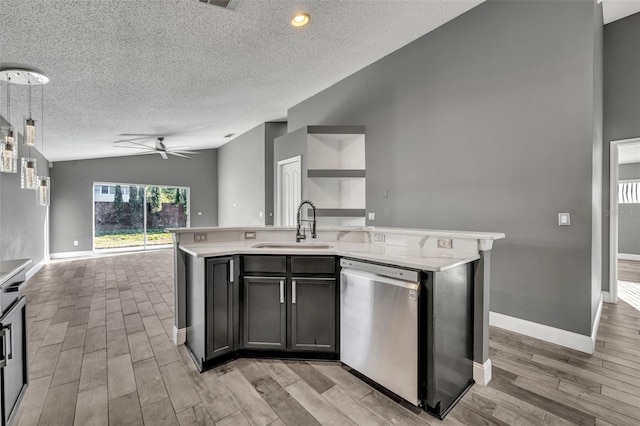 kitchen featuring lofted ceiling, a sink, open floor plan, stainless steel dishwasher, and an island with sink