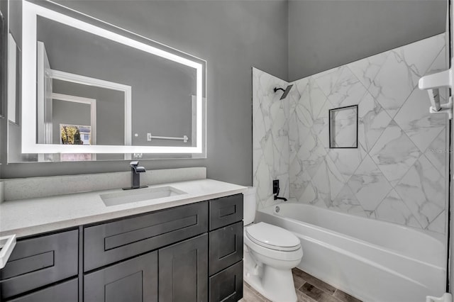 full bath featuring shower / bathtub combination, vanity, and toilet