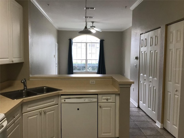 kitchen featuring crown molding, white dishwasher, a peninsula, and a sink