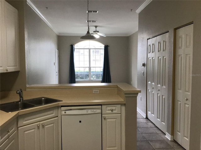 kitchen featuring a peninsula, a sink, white cabinetry, ornamental molding, and dishwasher