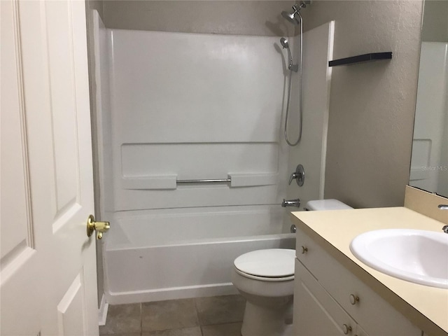 full bathroom featuring toilet, shower / tub combination, vanity, and tile patterned floors