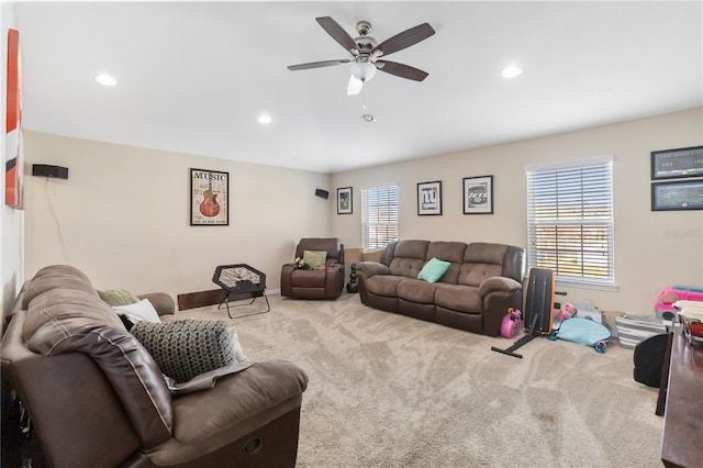 carpeted living room with ceiling fan, baseboards, and recessed lighting