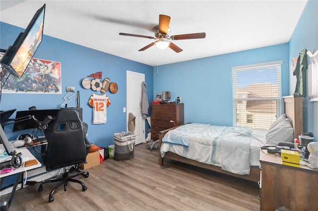 bedroom featuring ceiling fan and wood finished floors