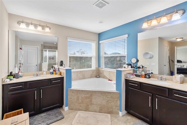 full bath featuring a stall shower, visible vents, a sink, and a bath