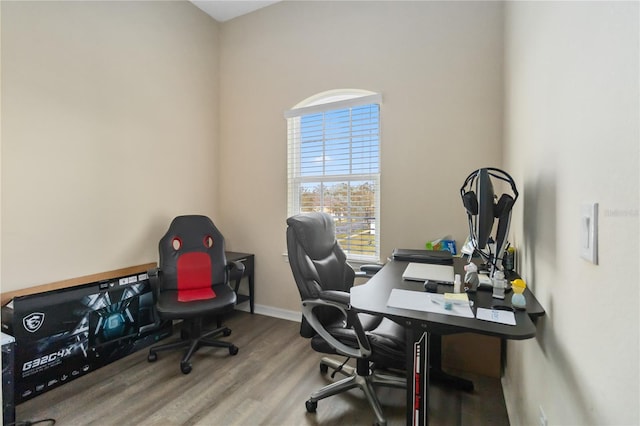 office featuring baseboards and wood finished floors