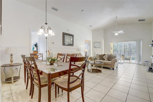 dining space featuring high vaulted ceiling, visible vents, and light tile patterned flooring