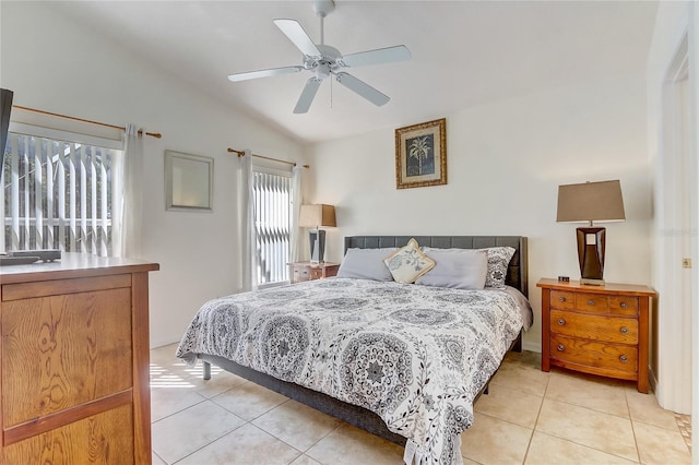 bedroom featuring a ceiling fan, lofted ceiling, and light tile patterned floors