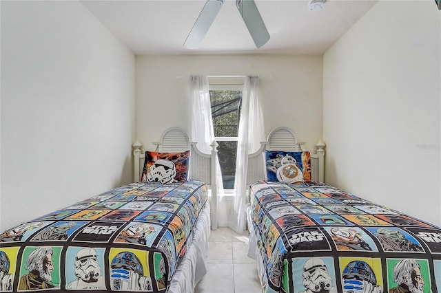 bedroom featuring light tile patterned floors and ceiling fan