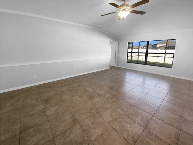 tiled empty room featuring crown molding, vaulted ceiling, baseboards, and ceiling fan