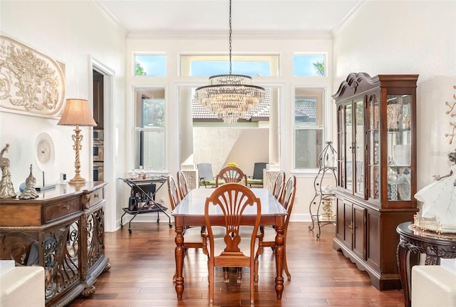 sunroom featuring a chandelier