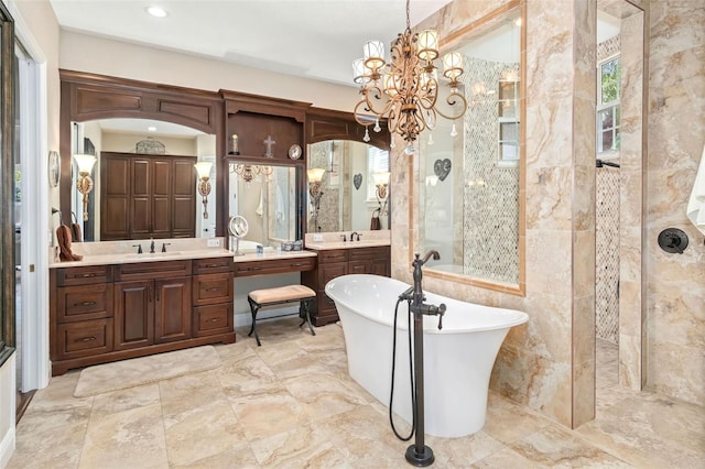 full bath with a stall shower, a freestanding tub, two vanities, and a sink