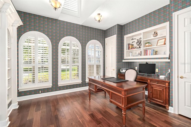 office space featuring baseboards, dark wood finished floors, and wallpapered walls