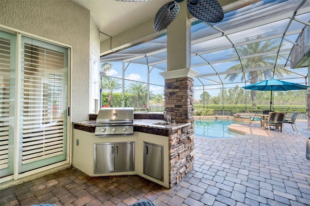 view of patio featuring a sink, an outdoor pool, area for grilling, and an in ground hot tub