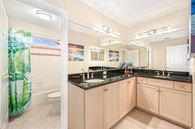 full bathroom with shower / bath combination with curtain, double vanity, tile patterned flooring, and a sink