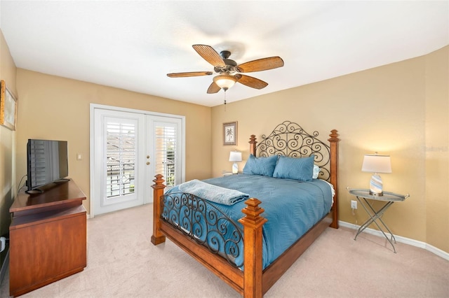 bedroom with light carpet, access to outside, a ceiling fan, and baseboards