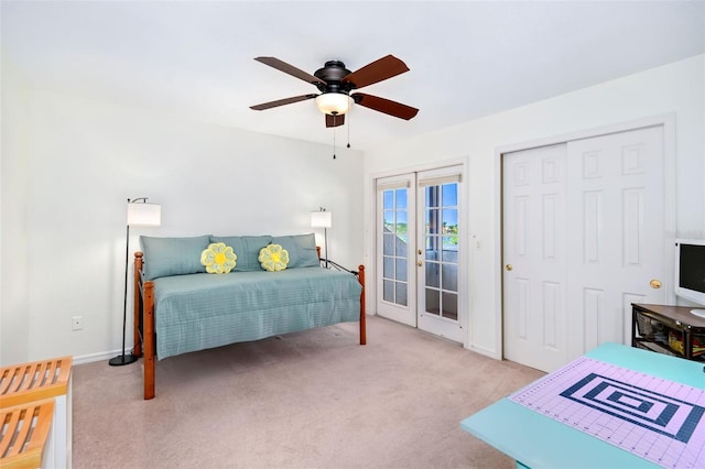 bedroom with access to exterior, french doors, a closet, light carpet, and ceiling fan