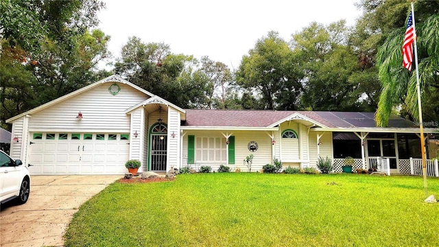 ranch-style house with a front yard, concrete driveway, covered porch, and an attached garage