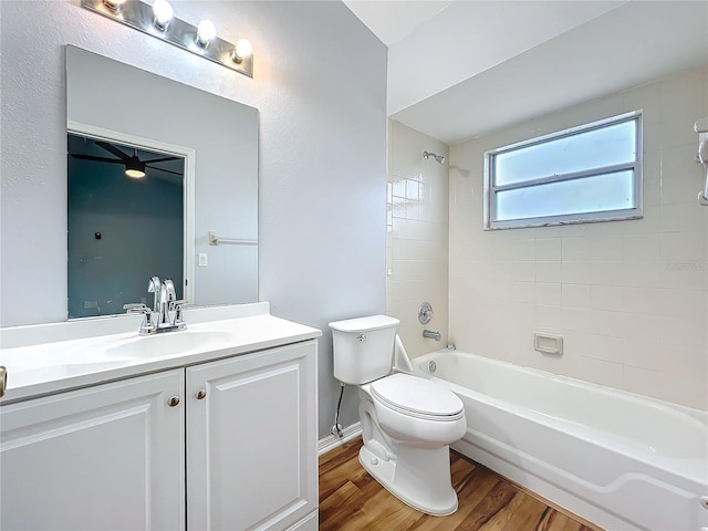 full bathroom featuring shower / bathtub combination, toilet, wood finished floors, and vanity