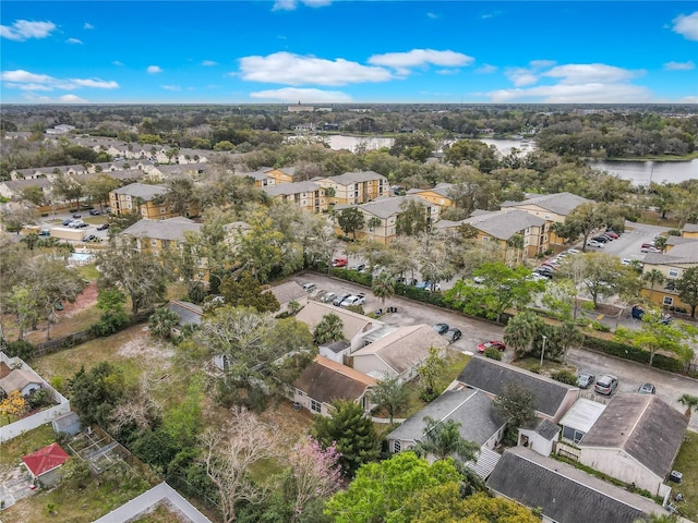 birds eye view of property with a residential view and a water view