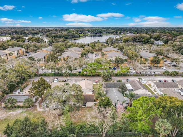 birds eye view of property with a water view and a residential view