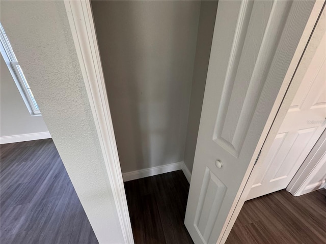 details with baseboards and wood finished floors