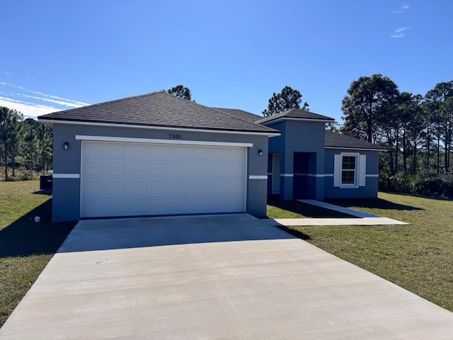 ranch-style home with driveway, a front yard, an attached garage, and stucco siding