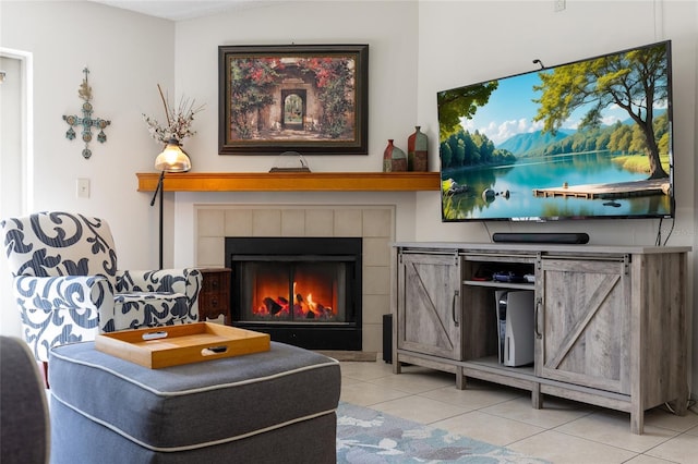 interior space with a tile fireplace and tile patterned floors