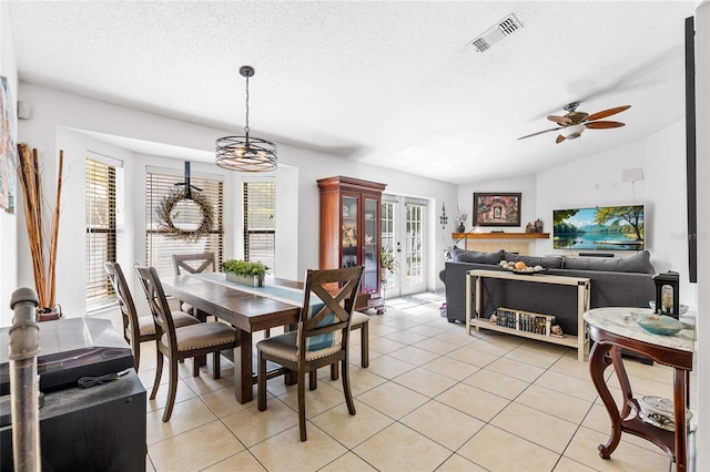 dining space featuring visible vents, light tile patterned floors, a wealth of natural light, and ceiling fan