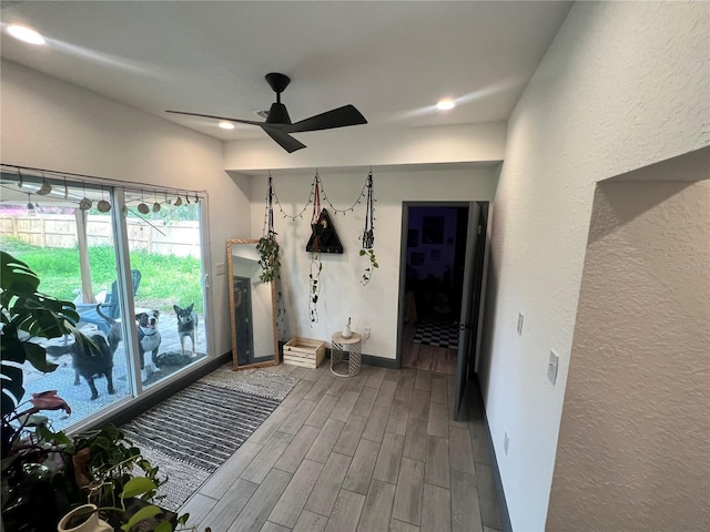 interior space with recessed lighting, baseboards, a ceiling fan, and wood finish floors