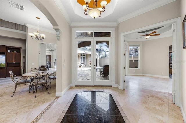 doorway featuring visible vents, crown molding, and baseboards