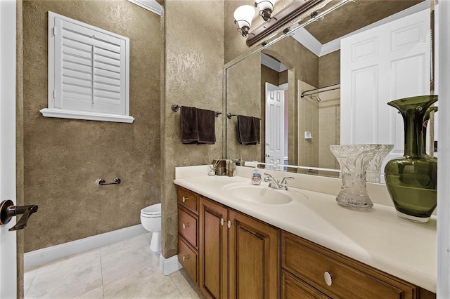 bathroom with baseboards, a shower, toilet, tile patterned flooring, and vanity