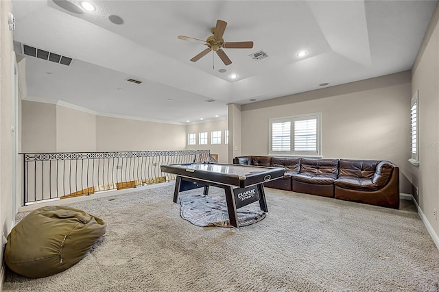 rec room featuring carpet, a raised ceiling, and visible vents