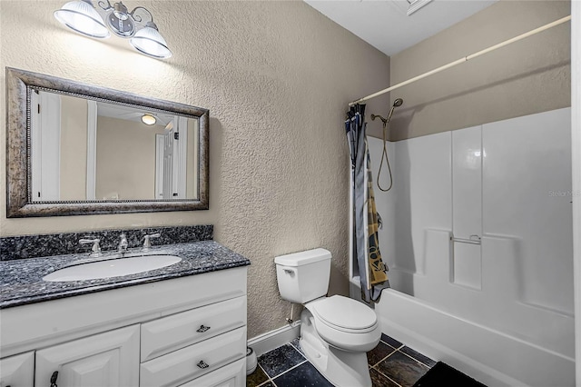 full bathroom featuring shower / bath combination with curtain, a textured wall, toilet, vanity, and tile patterned flooring