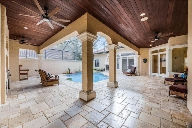 view of patio featuring a fenced in pool, french doors, and ceiling fan