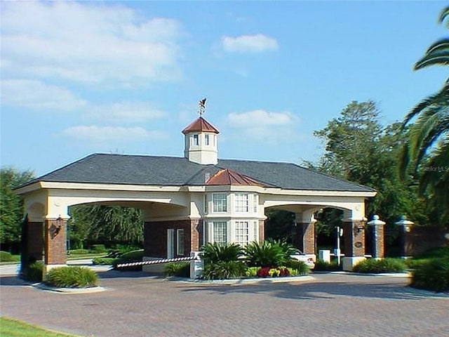 view of property with decorative driveway