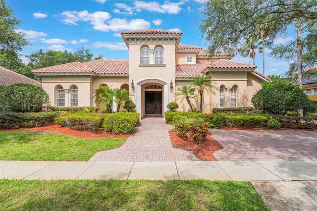 8814 Southern Breeze Dr, Orlando, FL 32836 - mediterranean / spanish-style home featuring a tile roof and stucco siding