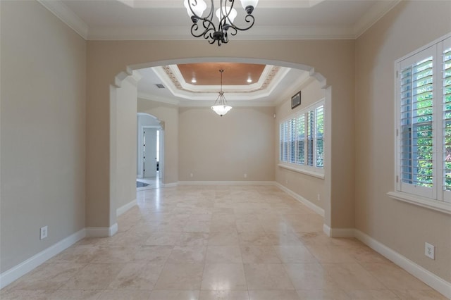 8814 Southern Breeze Dr, Orlando, FL 32836 - unfurnished room with arched walkways, crown molding, a tray ceiling, and a chandelier