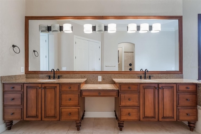 8814 Southern Breeze Dr, Orlando, FL 32836 - bathroom with double vanity, tile patterned flooring, and a shower
