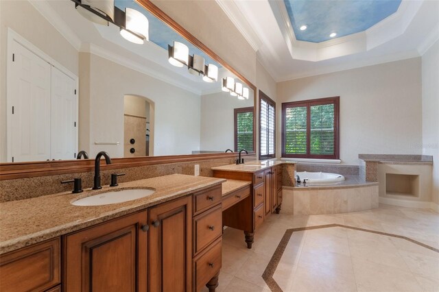 8814 Southern Breeze Dr, Orlando, FL 32836 - full bathroom featuring tile patterned floors, a bath, vanity, crown molding, and inlaid floor details