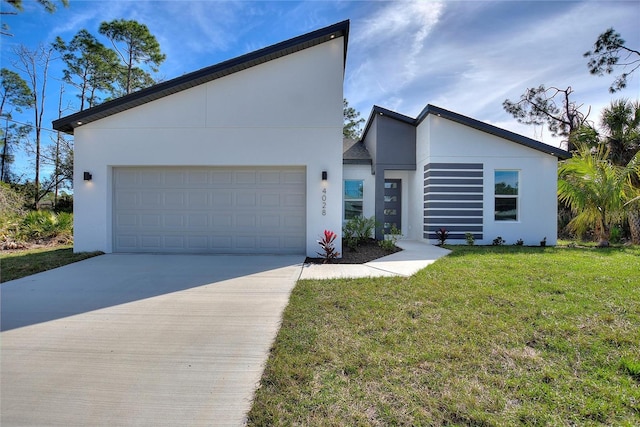 contemporary house featuring a garage, concrete driveway, a front lawn, and stucco siding